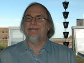 Ron stands in front of our old green roof