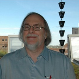 Ron stands in front of our old green roof